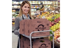 Woman with the ProWave from Hilex in a supemarket.
